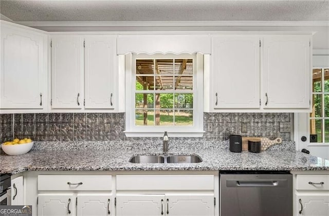 kitchen featuring white cabinets, a sink, and dishwasher