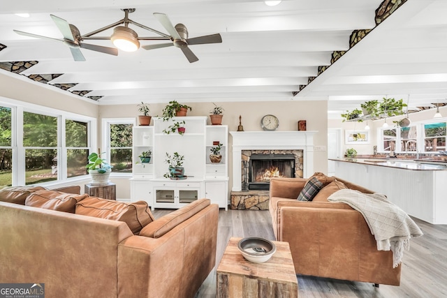 701 Mask Rd, Brooks, GA 30205 - living room featuring light wood-style floors, ceiling fan, and beamed ceiling