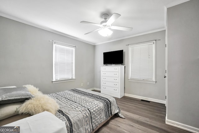 701 Mask Rd, Brooks, GA 30205 - bedroom featuring a ceiling fan, baseboards, wood finished floors, visible vents, and ornamental molding