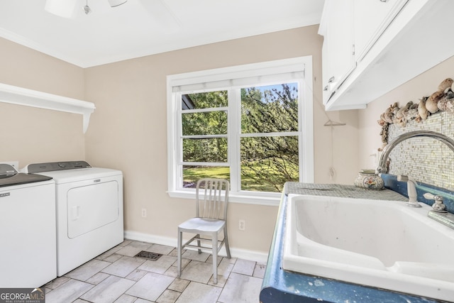 701 Mask Rd, Brooks, GA 30205 - laundry area featuring cabinet space, independent washer and dryer, baseboards, and a sink