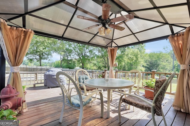 701 Mask Rd, Brooks, GA 30205 - deck featuring outdoor dining area, a ceiling fan, a gazebo, and a fenced backyard