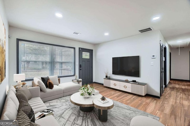 2091 Parker Ranch Rd SE, Atlanta, GA 30316 - living area with recessed lighting, attic access, wood finished floors, and a healthy amount of sunlight