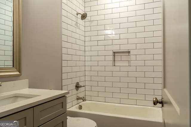 full bath with vanity, toilet, and shower / washtub combination
