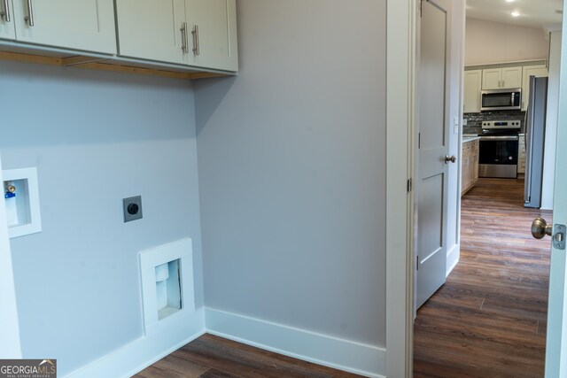 clothes washing area with baseboards, dark wood-type flooring, hookup for an electric dryer, cabinet space, and washer hookup