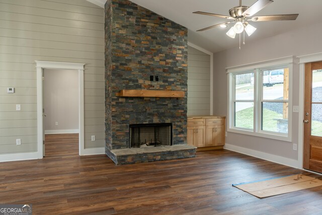 unfurnished living room with dark wood-style flooring, baseboards, ceiling fan, and lofted ceiling