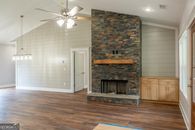 unfurnished living room with baseboards, dark wood-style flooring, ceiling fan, and vaulted ceiling
