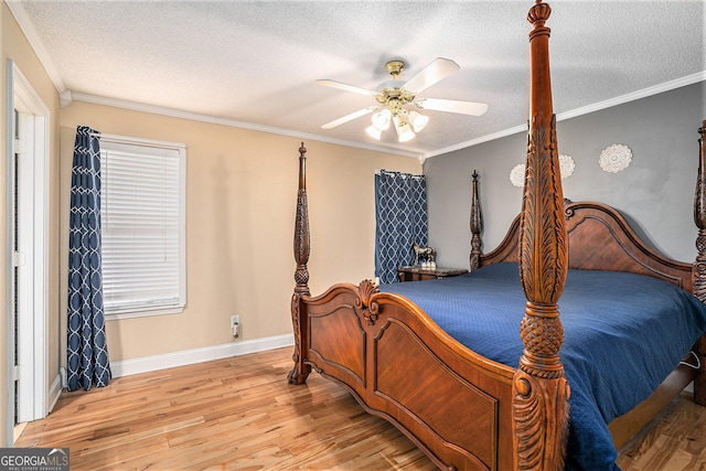 221 Hunters Xing SE, Calhoun, GA 30701 - bedroom featuring wood finished floors, a textured ceiling, crown molding, and a ceiling fan