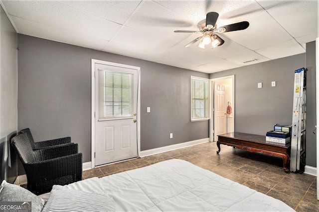 221 Hunters Xing SE, Calhoun, GA 30701 - bedroom featuring a paneled ceiling, a ceiling fan, and tile patterned floors