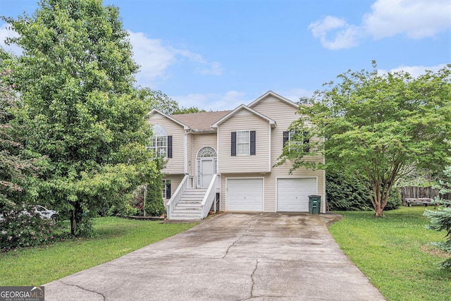 221 Hunters Xing SE, Calhoun, GA 30701 - raised ranch with a garage, concrete driveway, and a front lawn