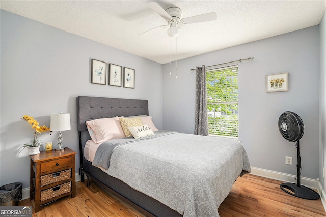 221 Hunters Xing SE, Calhoun, GA 30701 - bedroom with hardwood / wood-style flooring and a ceiling fan