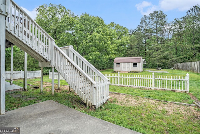 221 Hunters Xing SE, Calhoun, GA 30701 - view of yard featuring stairway and a storage shed