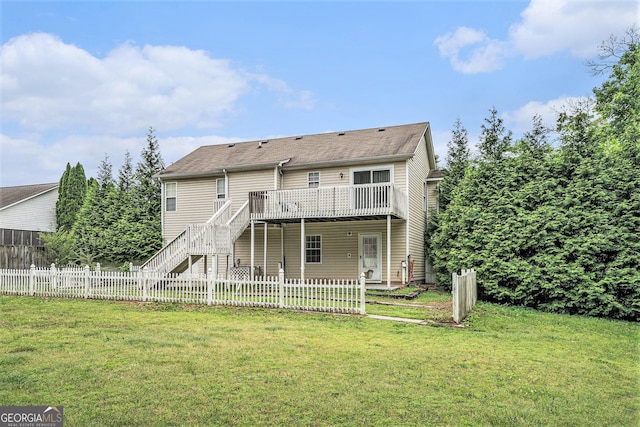 221 Hunters Xing SE, Calhoun, GA 30701 - back of property with a deck, stairway, and a fenced backyard