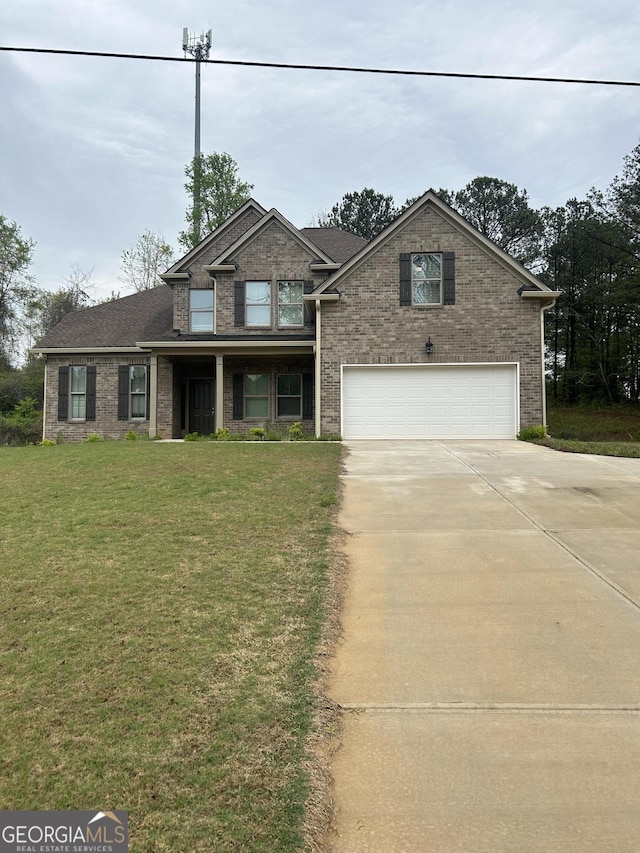 view of front of home with concrete driveway, brick siding, a front lawn, and a garage