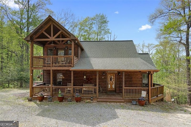 675 Green Ridge Rd, Blue Ridge, GA 30513 - view of front facade featuring a balcony, roof with shingles, covered porch, and log veneer siding