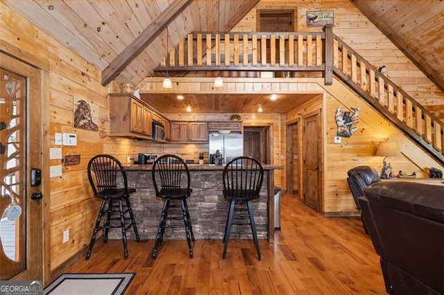 675 Green Ridge Rd, Blue Ridge, GA 30513 - kitchen featuring wooden walls, appliances with stainless steel finishes, wooden ceiling, and hardwood / wood-style flooring