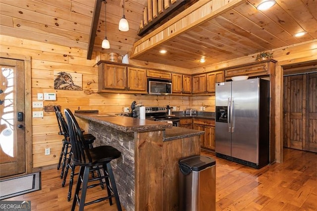 675 Green Ridge Rd, Blue Ridge, GA 30513 - kitchen featuring appliances with stainless steel finishes, hardwood / wood-style flooring, wood ceiling, and brown cabinets