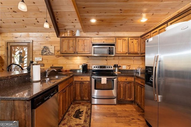 675 Green Ridge Rd, Blue Ridge, GA 30513 - kitchen featuring wood ceiling, brown cabinets, a sink, a peninsula, and stainless steel appliances
