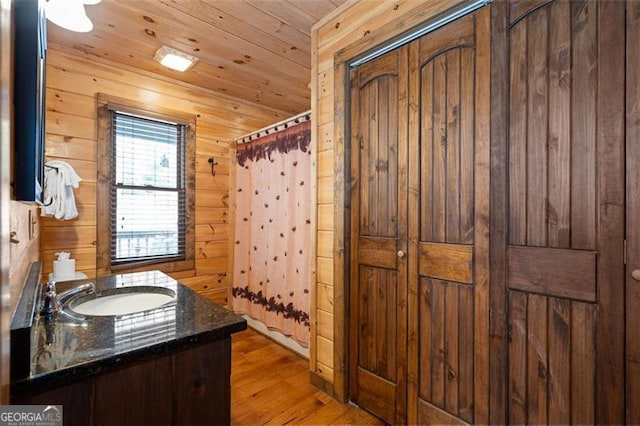 675 Green Ridge Rd, Blue Ridge, GA 30513 - full bath with vanity, wood walls, a shower with shower curtain, wooden ceiling, and wood finished floors