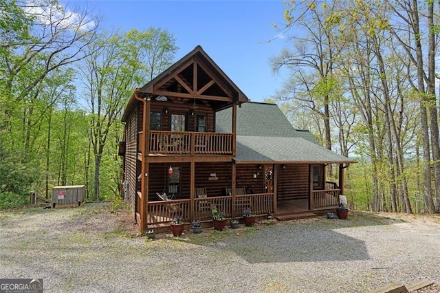 675 Green Ridge Rd, Blue Ridge, GA 30513 - view of front of home with roof with shingles, faux log siding, a porch, and a balcony