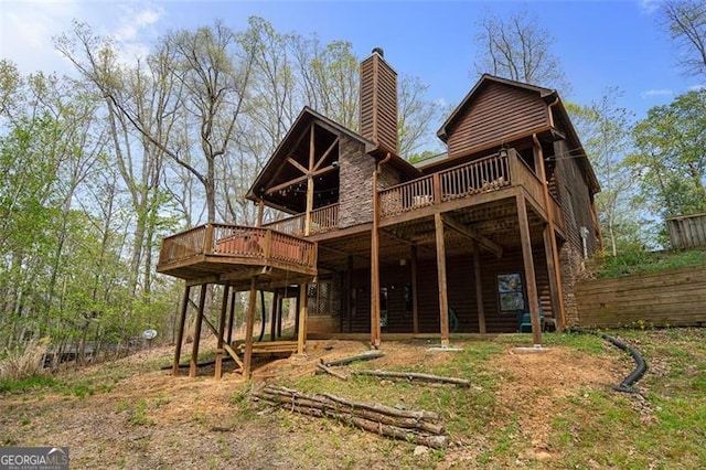 675 Green Ridge Rd, Blue Ridge, GA 30513 - back of house featuring fence, a wooden deck, and a chimney