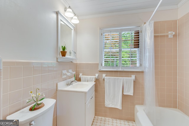 bathroom with crown molding, vanity, shower / bath combo with shower curtain, toilet, and tile walls