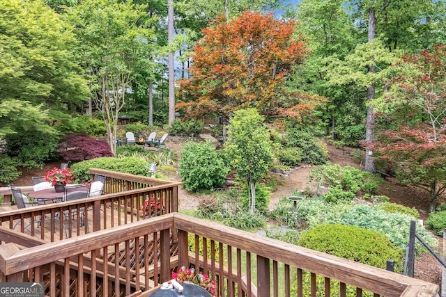 wooden deck with outdoor dining space