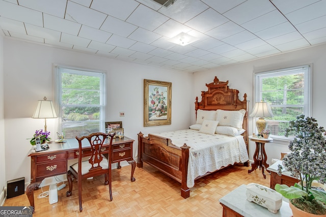bedroom with multiple windows