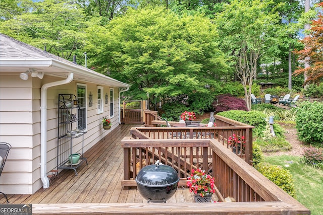wooden deck with outdoor dining space