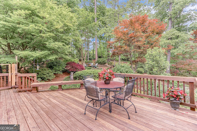 wooden deck with outdoor dining area
