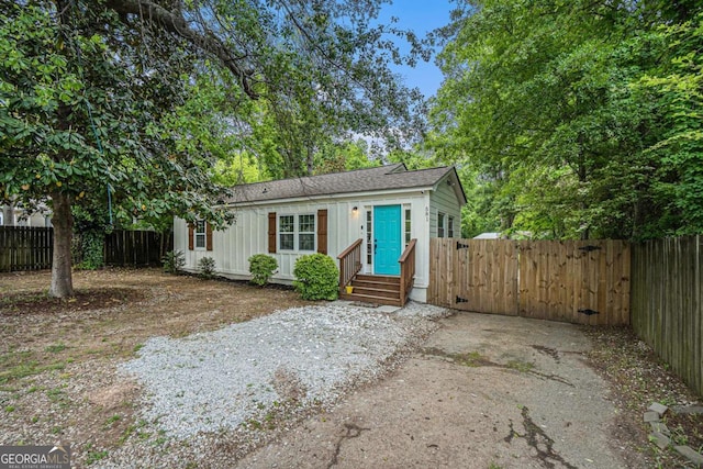 581 Taylor Dr SE, Smyrna, GA 30080 - view of front of house with board and batten siding and fence