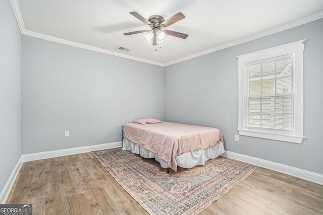 581 Taylor Dr SE, Smyrna, GA 30080 - bedroom featuring visible vents, crown molding, and wood finished floors