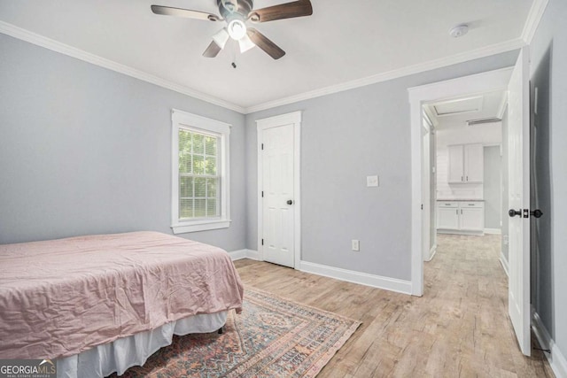 581 Taylor Dr SE, Smyrna, GA 30080 - bedroom with a ceiling fan, attic access, baseboards, ornamental molding, and light wood-style flooring