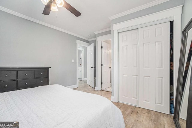 581 Taylor Dr SE, Smyrna, GA 30080 - bedroom featuring crown molding, a closet, baseboards, ceiling fan, and light wood finished floors