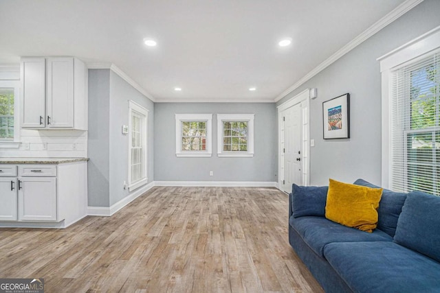 581 Taylor Dr SE, Smyrna, GA 30080 - living room with recessed lighting, baseboards, ornamental molding, and light wood-style flooring