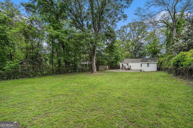 581 Taylor Dr SE, Smyrna, GA 30080 - view of yard with a patio and a fenced backyard