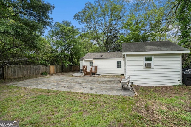 581 Taylor Dr SE, Smyrna, GA 30080 - rear view of house with fence, a shingled roof, a yard, and a patio area