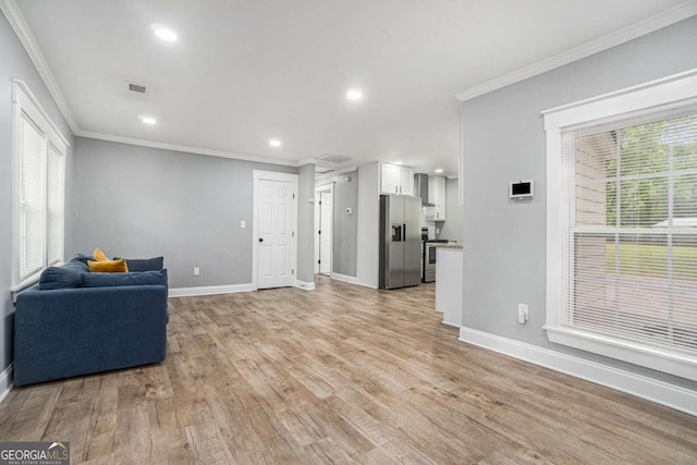 581 Taylor Dr SE, Smyrna, GA 30080 - unfurnished living room with recessed lighting, baseboards, visible vents, and ornamental molding