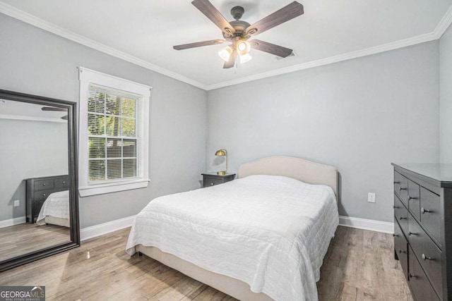 581 Taylor Dr SE, Smyrna, GA 30080 - bedroom with baseboards, crown molding, wood finished floors, and ceiling fan