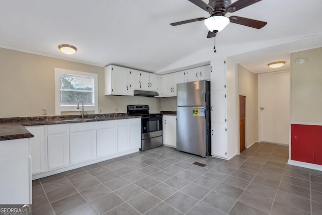 kitchen with appliances with stainless steel finishes, dark countertops, a sink, lofted ceiling, and under cabinet range hood