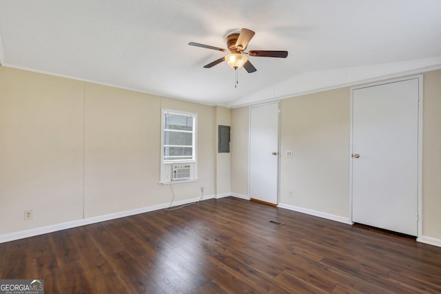 unfurnished bedroom featuring a ceiling fan, visible vents, hardwood / wood-style flooring, baseboards, and lofted ceiling