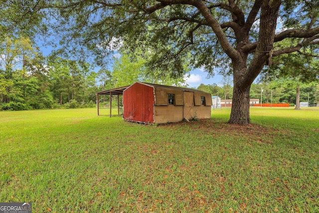 view of outbuilding with an outbuilding and a carport