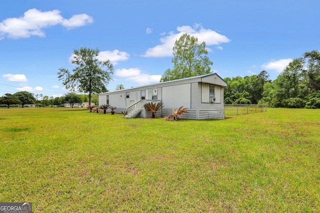 back of house with a yard
