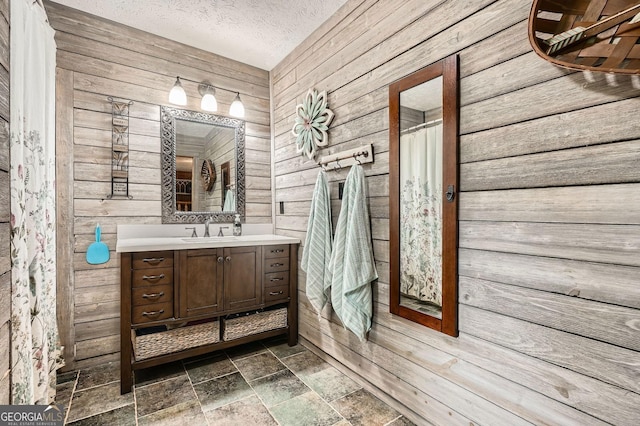 5419 Tyree Rd, Winston, GA 30187 - full bath with vanity, wood walls, a textured ceiling, and stone finish floor