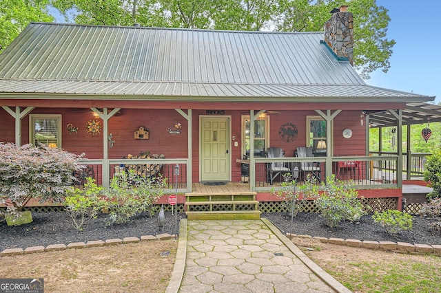 5419 Tyree Rd, Winston, GA 30187 - view of front of house featuring a porch, a chimney, and metal roof