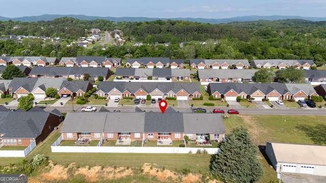 birds eye view of property with a residential view and a forest view