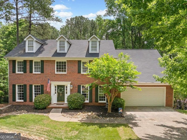 815 Lake Forest Pass, Roswell, GA 30076 - colonial inspired home with concrete driveway, brick siding, and a garage