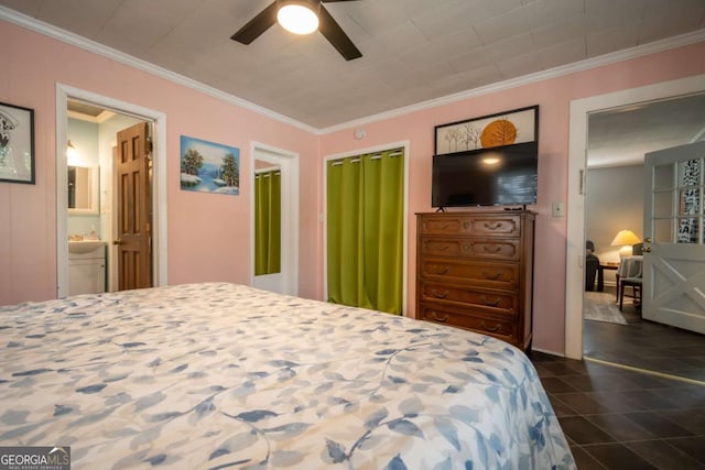 bedroom featuring crown molding, dark tile patterned floors, ceiling fan, and ensuite bathroom