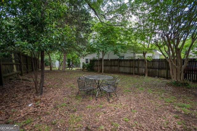 view of yard with a fenced backyard