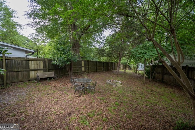 view of yard with a fenced backyard