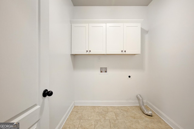 laundry room featuring cabinet space, hookup for a washing machine, electric dryer hookup, baseboards, and light tile patterned floors